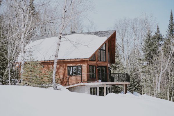 modern house with a snow covered roof